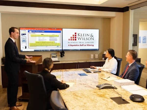 Photo of the legal professionals of Klein & Wilson at the firm's conference room